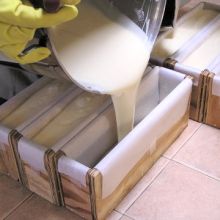 Pouring cold process soap into molds.